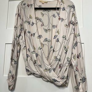 Silky, open, flowing top, very light pink background with floral print